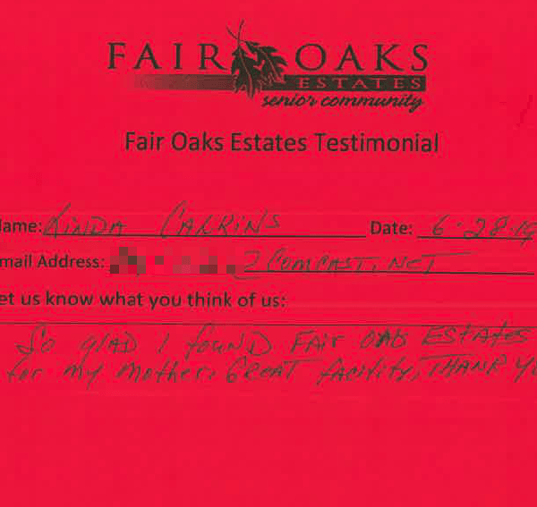 A red envelope with a note on it that says fair oaks testimonial.