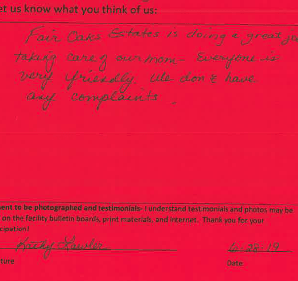 A handwritten note on a red piece of paper.